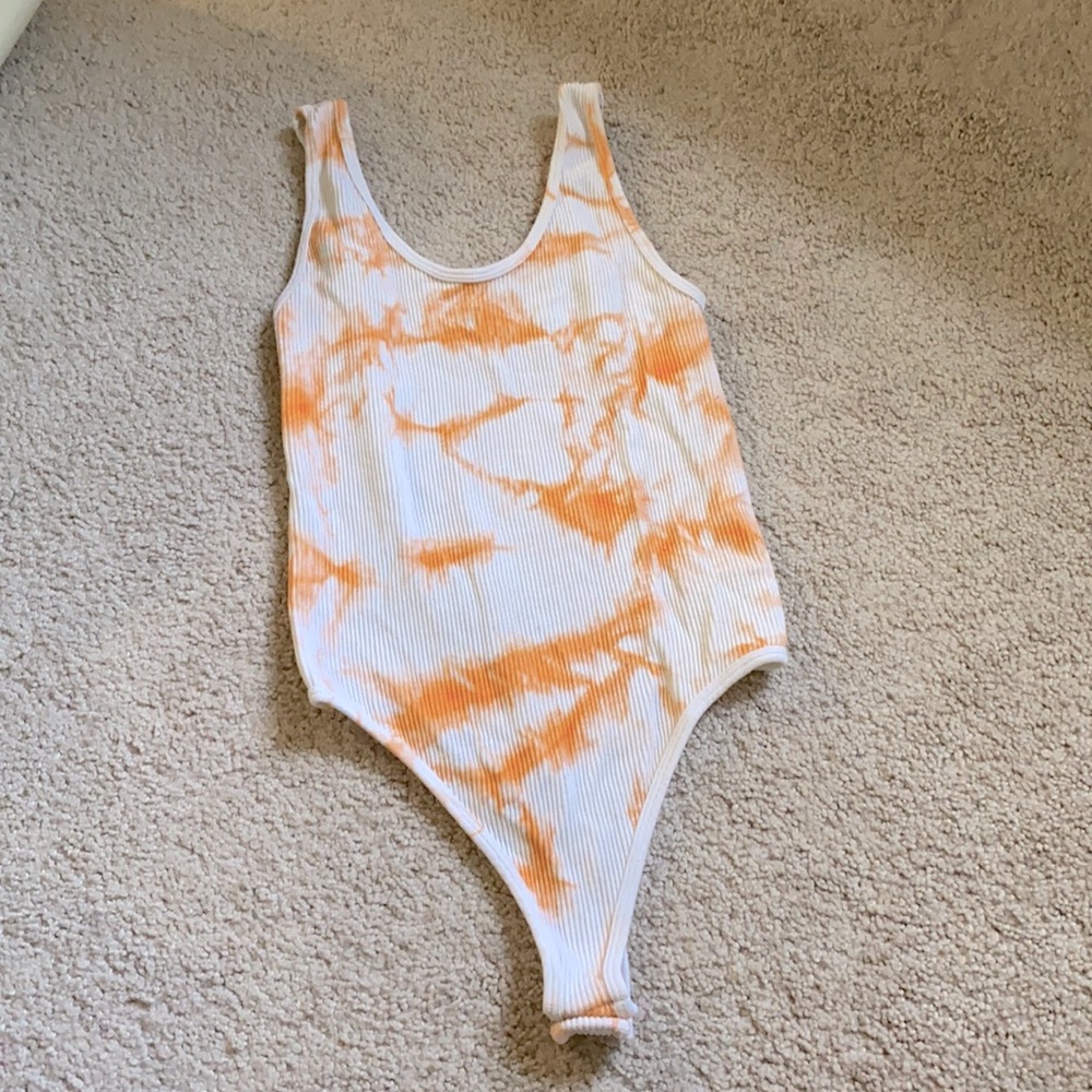 white and orange body suit